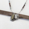 baby dino necklace with gold sheen obsidian gemstone on oxidized sterling silver