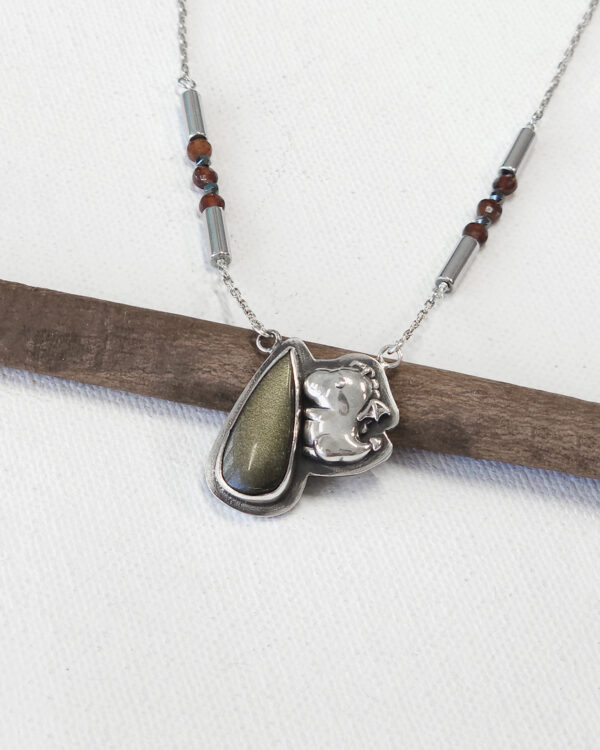 baby dino necklace with gold sheen obsidian gemstone on oxidized sterling silver