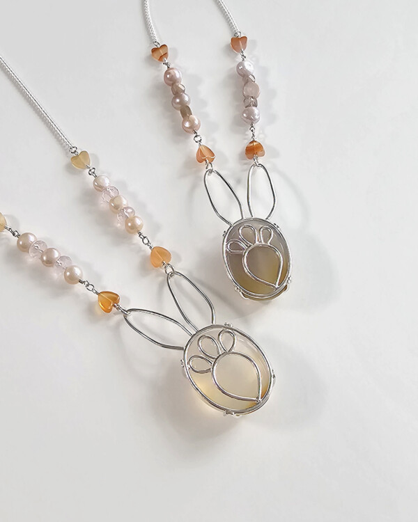 bunny necklace with semi opaque agate cabochon sets on sterling silver rabbit silhouette