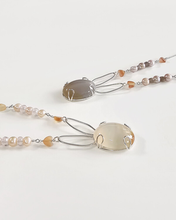 bunny necklace with semi opaque agate cabochon sets on sterling silver rabbit silhouette