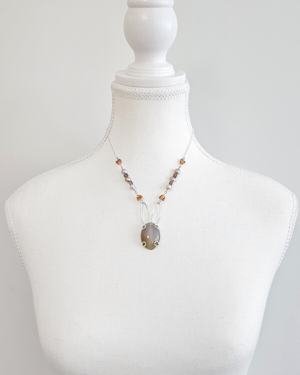 bunny necklace with semi opaque agate cabochon sets on sterling silver rabbit silhouette