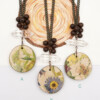 decoupage on wood slice pendant necklace with double terminated crystal quartz gemstone