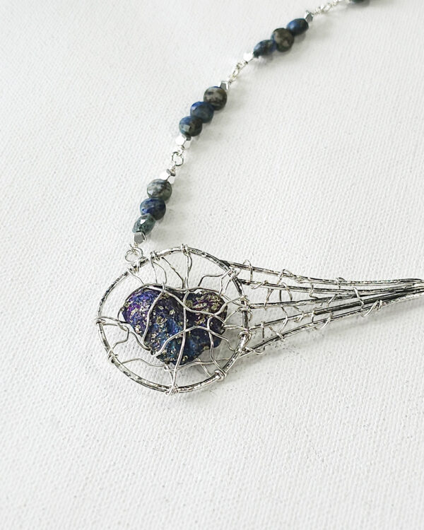 meteor inspired handmade necklace with silver wire-wrapped peacock ore and azurite beads