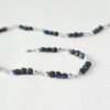 meteor inspired handmade necklace with silver wire-wrapped peacock ore and azurite beads