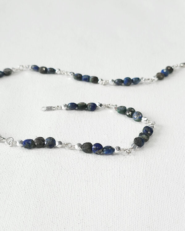 meteor inspired handmade necklace with silver wire-wrapped peacock ore and azurite beads