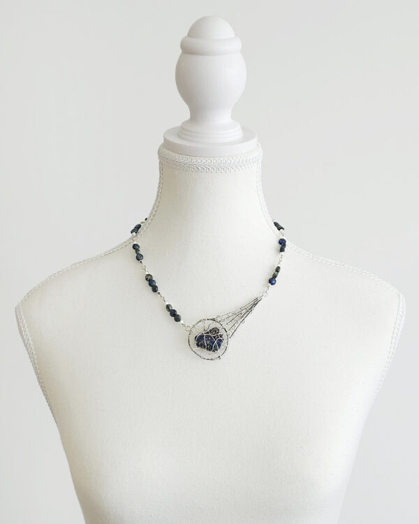 meteor inspired handmade necklace with silver wire-wrapped peacock ore and azurite beads