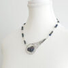 meteor inspired handmade necklace with silver wire-wrapped peacock ore and azurite beads